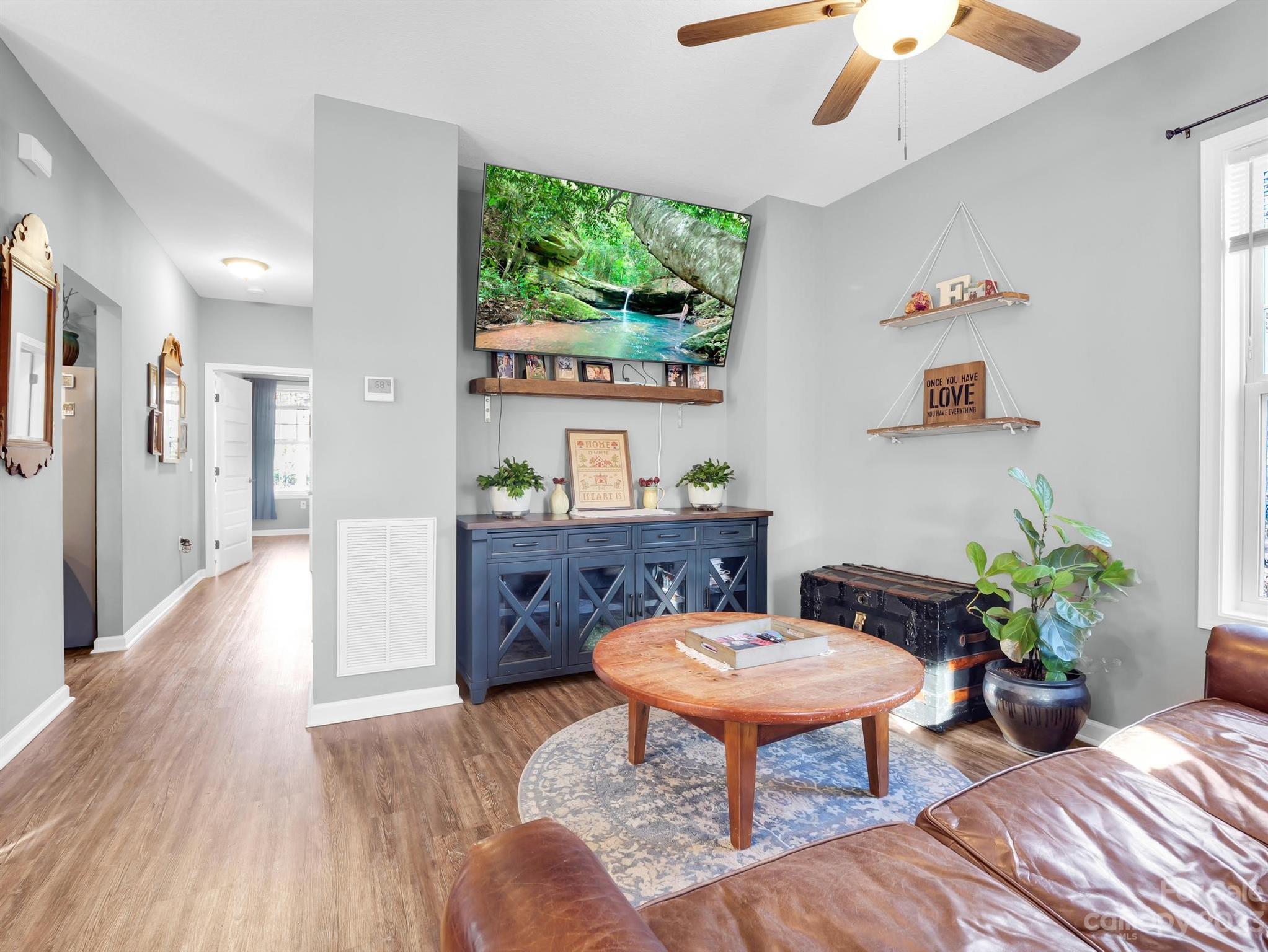 335 Mine Gap Road Flat Rock, NC 28731 - Photo 5 of 40 a workspace with furniture and a potted plant