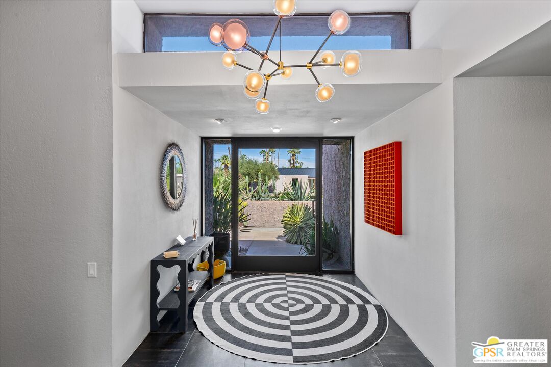 1075 East Suntan Lane Palm Springs, CA 92264 - Photo 18 of 39 a room with furniture and window