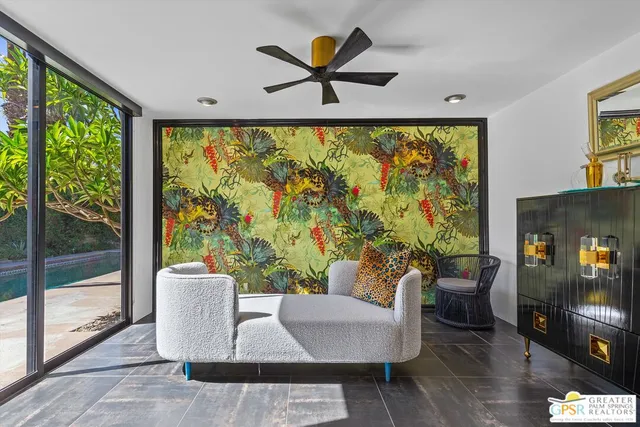 a living room with furniture and a large window