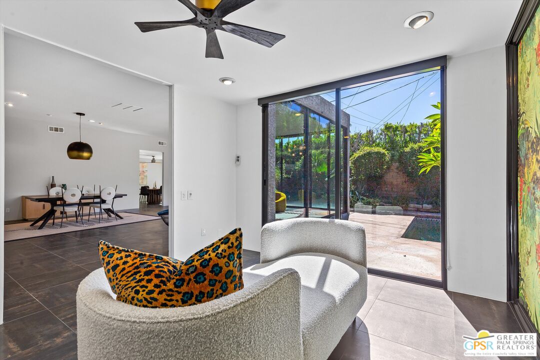 1075 East Suntan Lane Palm Springs, CA 92264 - Photo 20 of 39 a living room with furniture and a large window