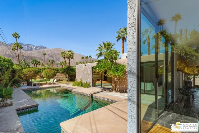 a balcony with table and chairs