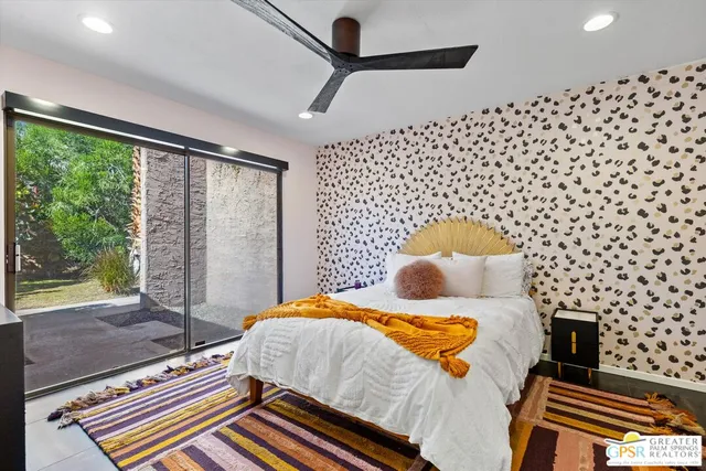 a bathroom with a sink mirror and toilet