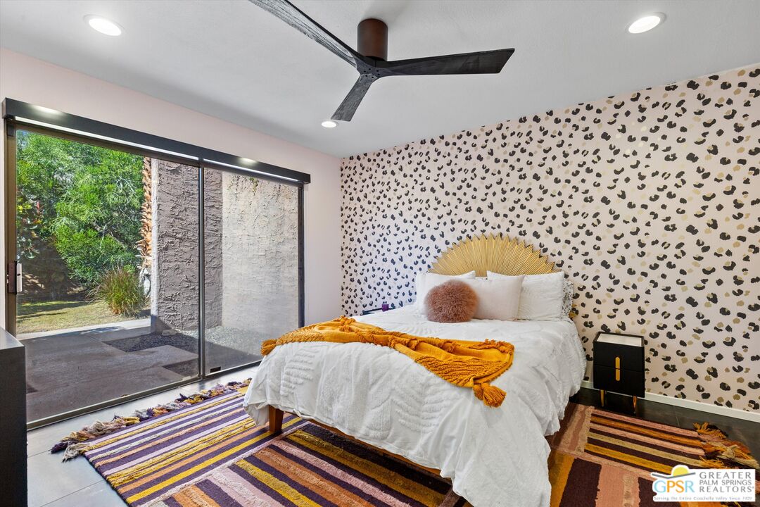 1075 East Suntan Lane Palm Springs, CA 92264 - Photo 25 of 39 a bedroom with a bed and wooden floor