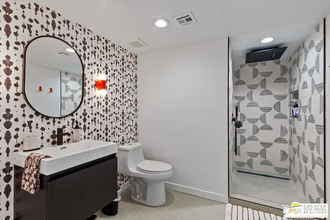 a bathroom with a sink and mirror