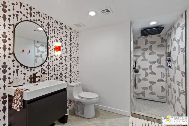 a bathroom with a sink and mirror