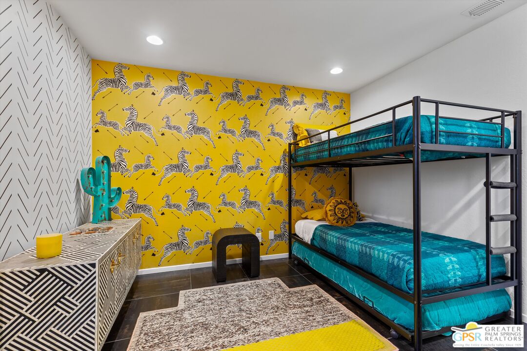 1075 East Suntan Lane Palm Springs, CA 92264 - Photo 28 of 39 a bedroom with a bed and a window