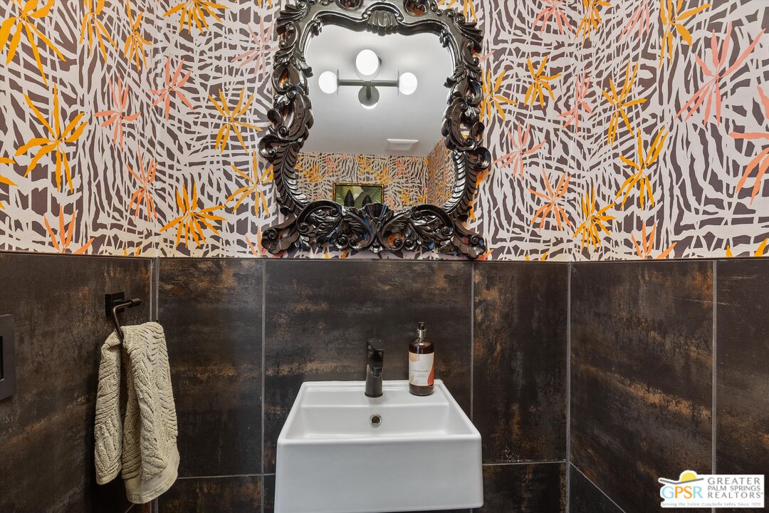 1075 East Suntan Lane Palm Springs, CA 92264 - Photo 29 of 39 a bathroom with a sink and mirror
