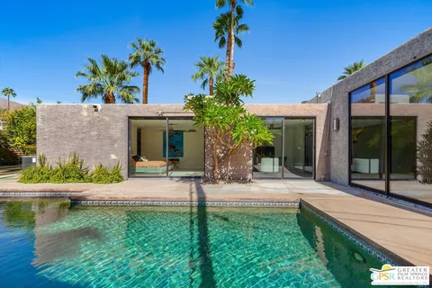 a view of a swimming pool with a patio