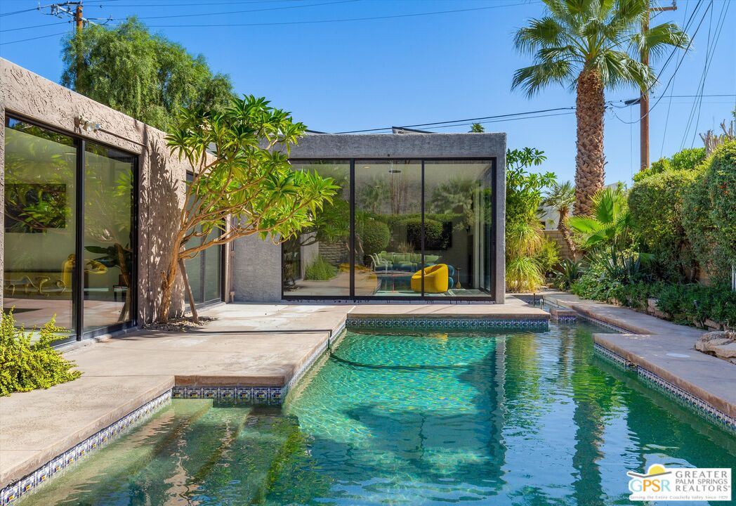 1075 East Suntan Lane Palm Springs, CA 92264 - Photo 33 of 39 a house view with a garden space