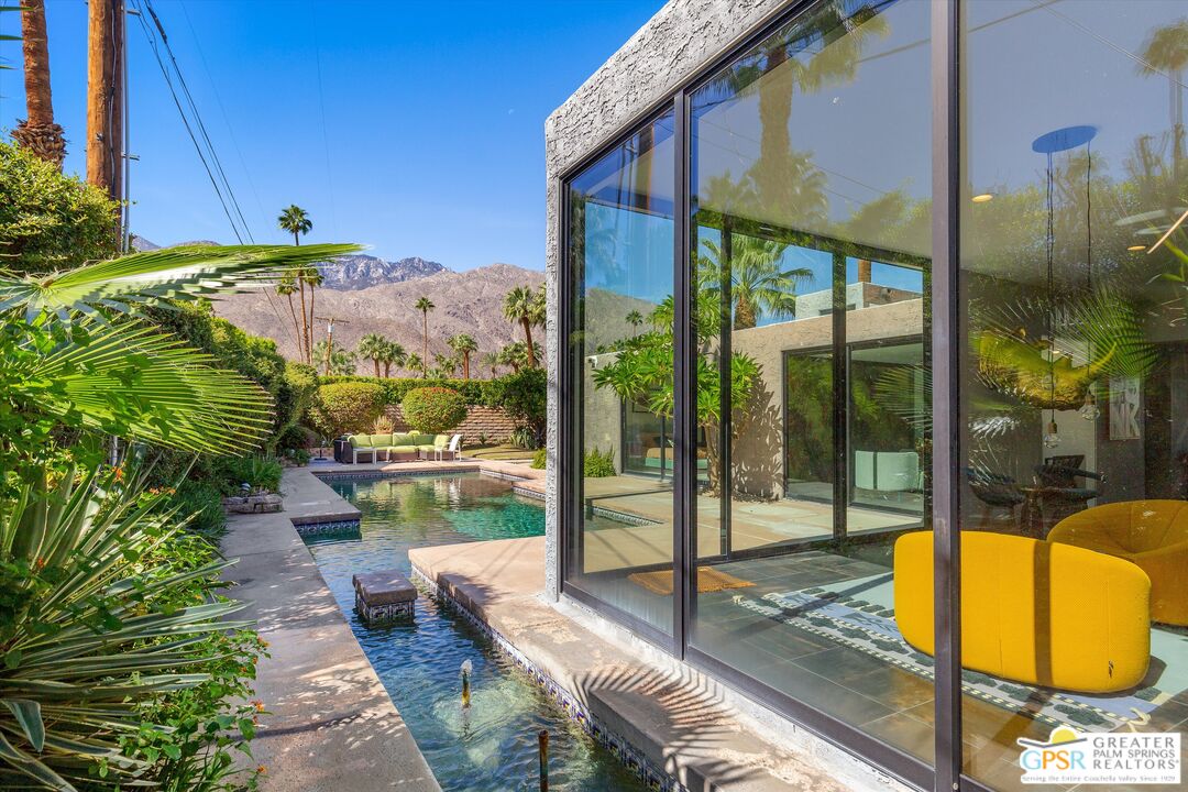 1075 East Suntan Lane Palm Springs, CA 92264 - Photo 34 of 39 a view of a swimming pool with a patio