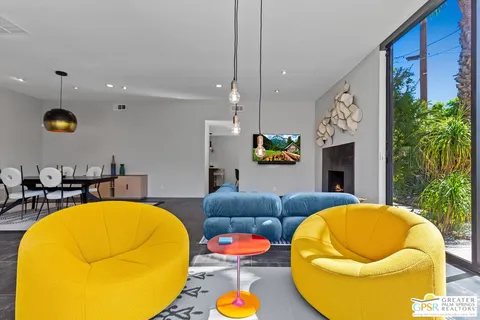 a view of a swimming pool with a lounge chairs