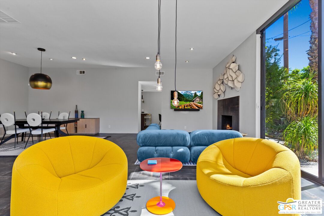 1075 East Suntan Lane Palm Springs, CA 92264 - Photo 8 of 39 a living room with furniture and a fireplace