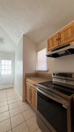 a kitchen with a stove and a microwave
