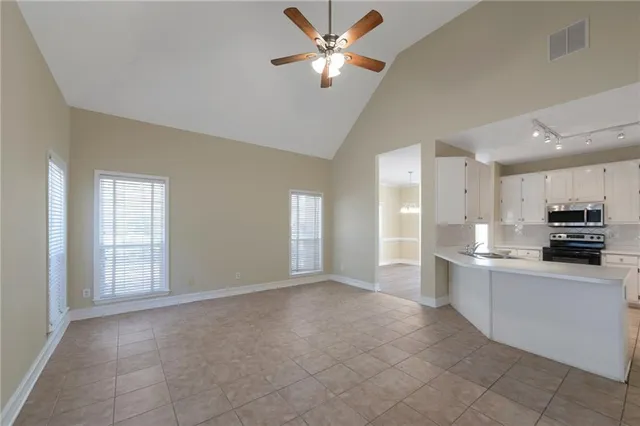 a view of a kitchen with a sink and a window