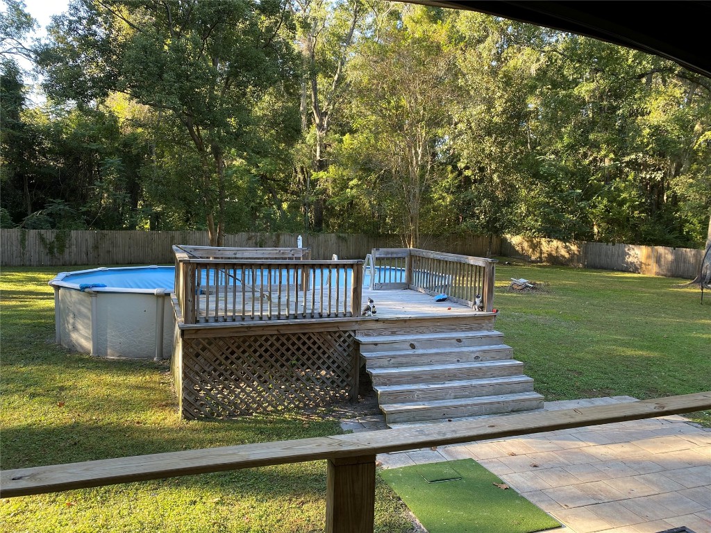 44079 Lee Drive Callahan, FL 32011 - Photo 13 of 32 a view of a swimming pool with a patio