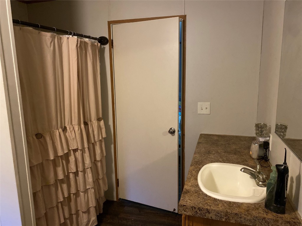 44079 Lee Drive Callahan, FL 32011 - Photo 21 of 32 a bathroom with a sink and a mirror