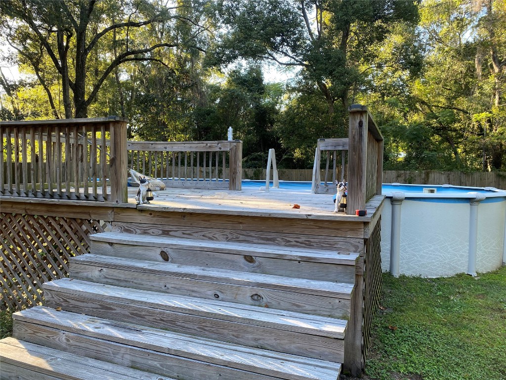 44079 Lee Drive Callahan, FL 32011 - Photo 8 of 32 a view of backyard with wooden fence and trees
