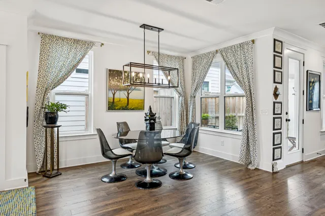 a kitchen with stainless steel appliances kitchen island granite countertop a sink stove and refrigerator