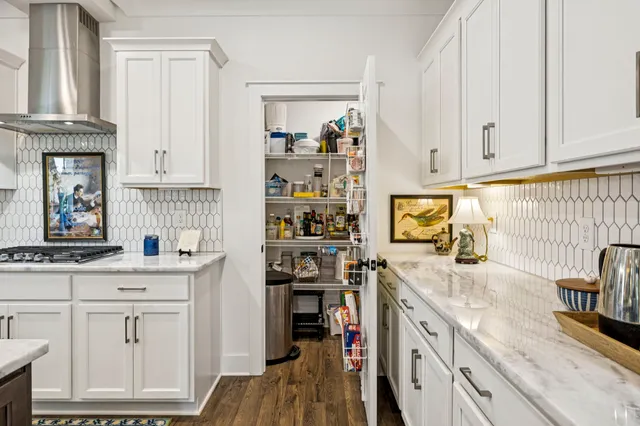 a bed room with a bed and a chandelier
