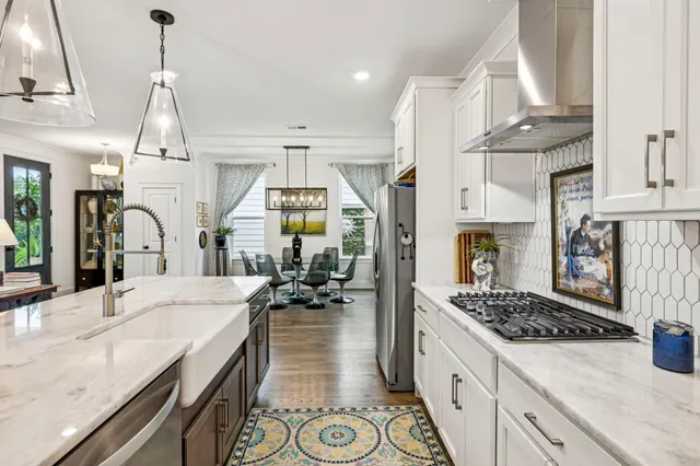a bathroom with a double vanity sink mirror and shower