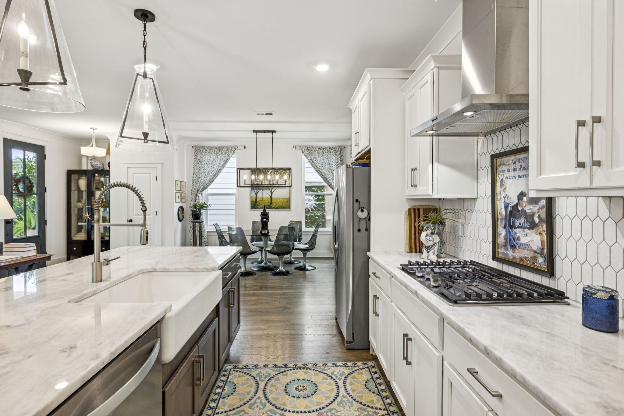 218 Southmen Lane Spring Hill, TN 37174 - Photo 29 of 73 a kitchen with stainless steel appliances kitchen island granite countertop a sink stove and refrigerator