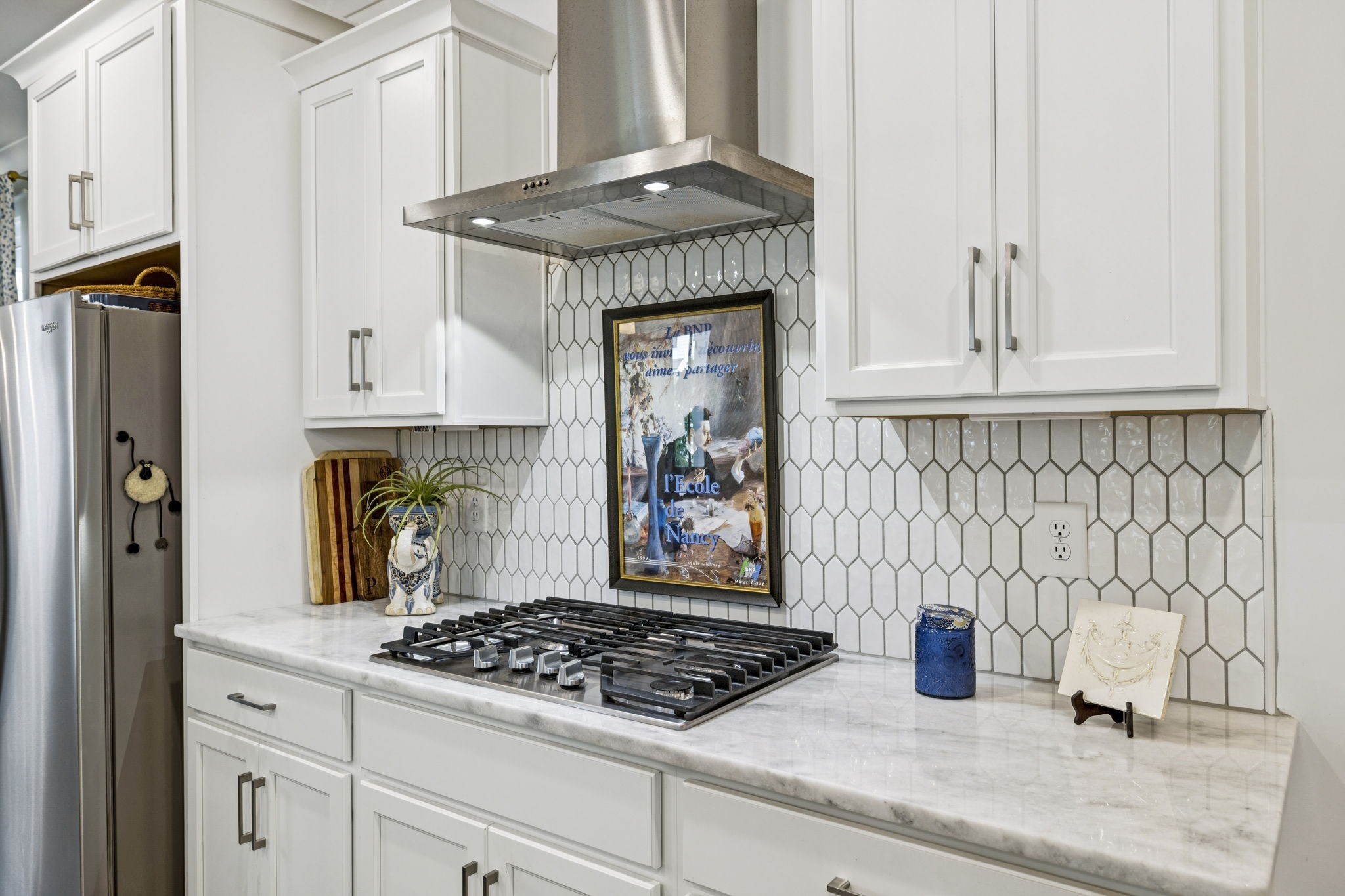 218 Southmen Lane Spring Hill, TN 37174 - Photo 30 of 73 a kitchen with stainless steel appliances granite countertop a stove and cabinets