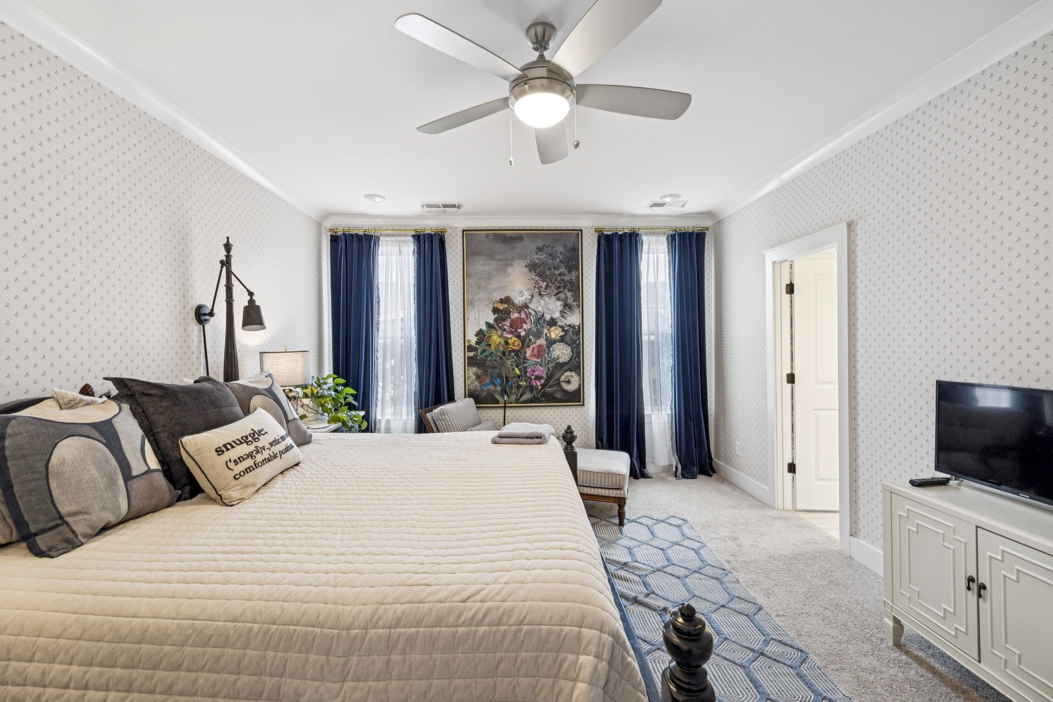 218 Southmen Lane Spring Hill, TN 37174 - Photo 37 of 73 a bedroom with a large bed and a flat screen tv