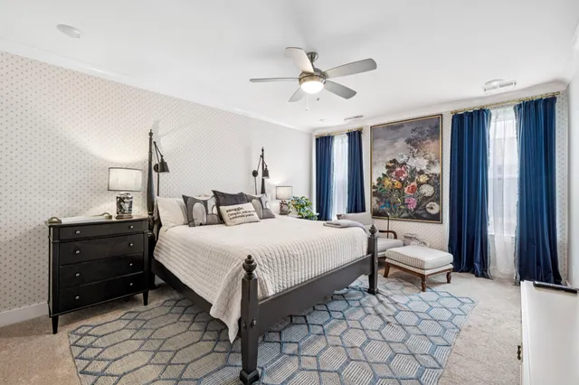 a bedroom with a bed and a dresser