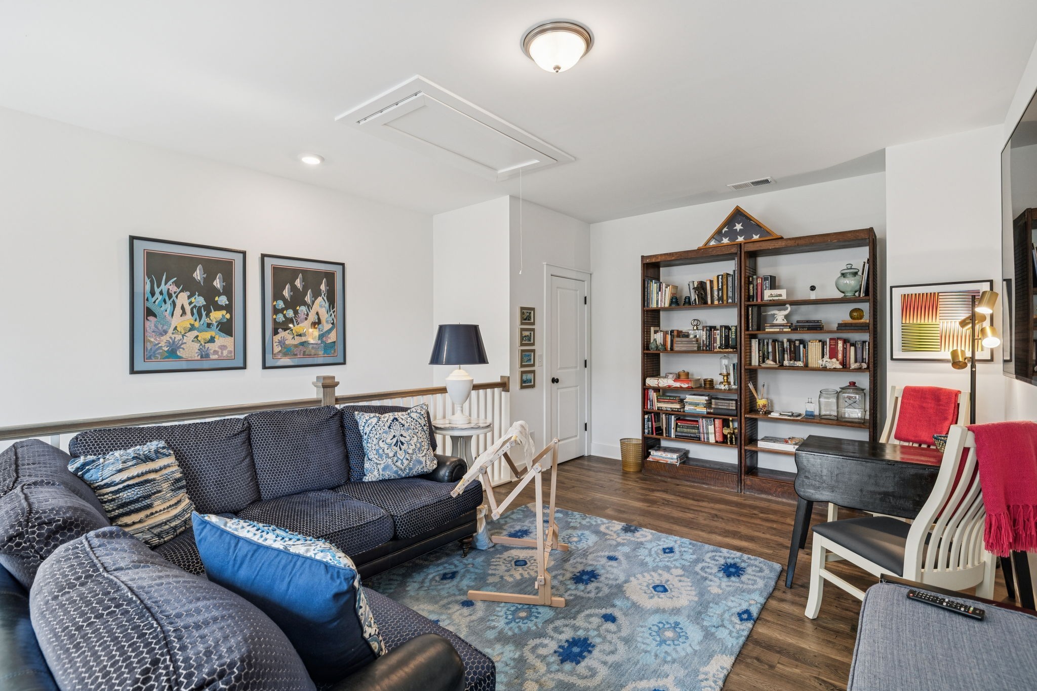 218 Southmen Lane Spring Hill, TN 37174 - Photo 53 of 73 a living room with furniture a rug and a bookshelf