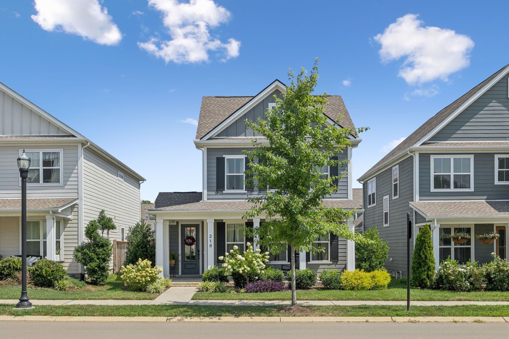 218 Southmen Lane Spring Hill, TN 37174 - Photo 8 of 73 a front view of a house with a garden
