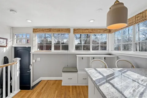 a spacious bedroom with a bed and wooden floor