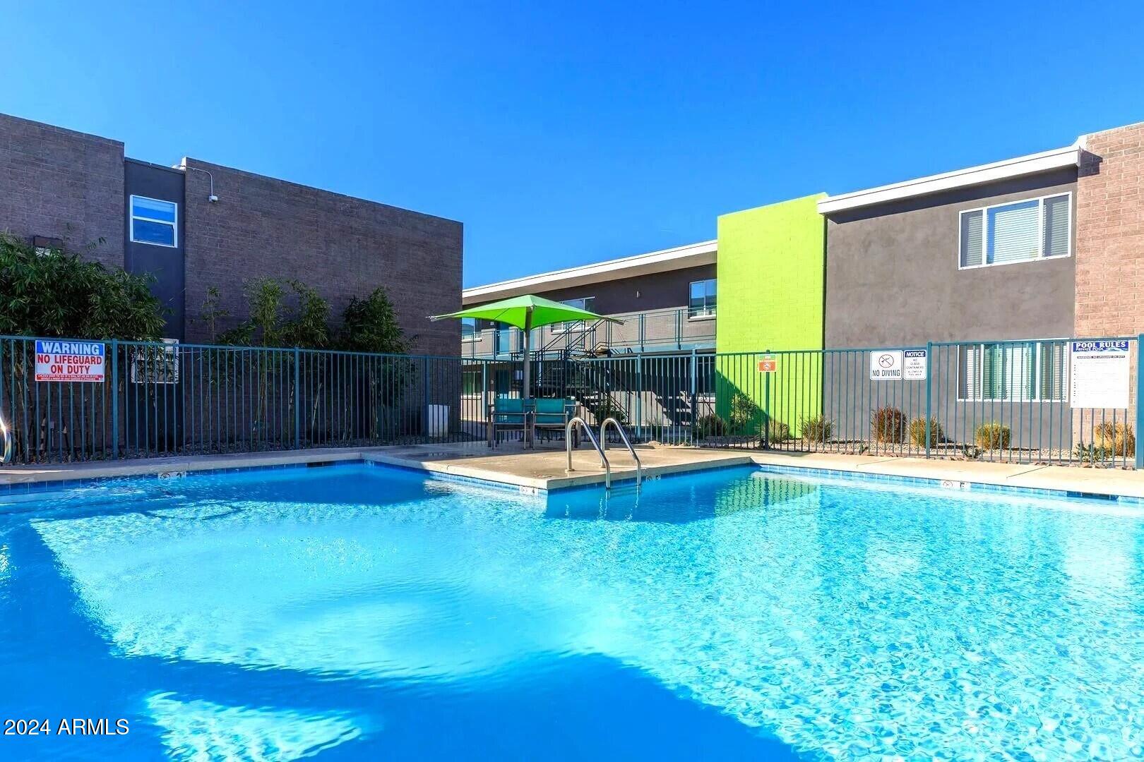 1220 North 44th Street, Unit 1 Phoenix, AZ 85008 - Photo 14 of 15 a view of a house with swimming pool and sitting area