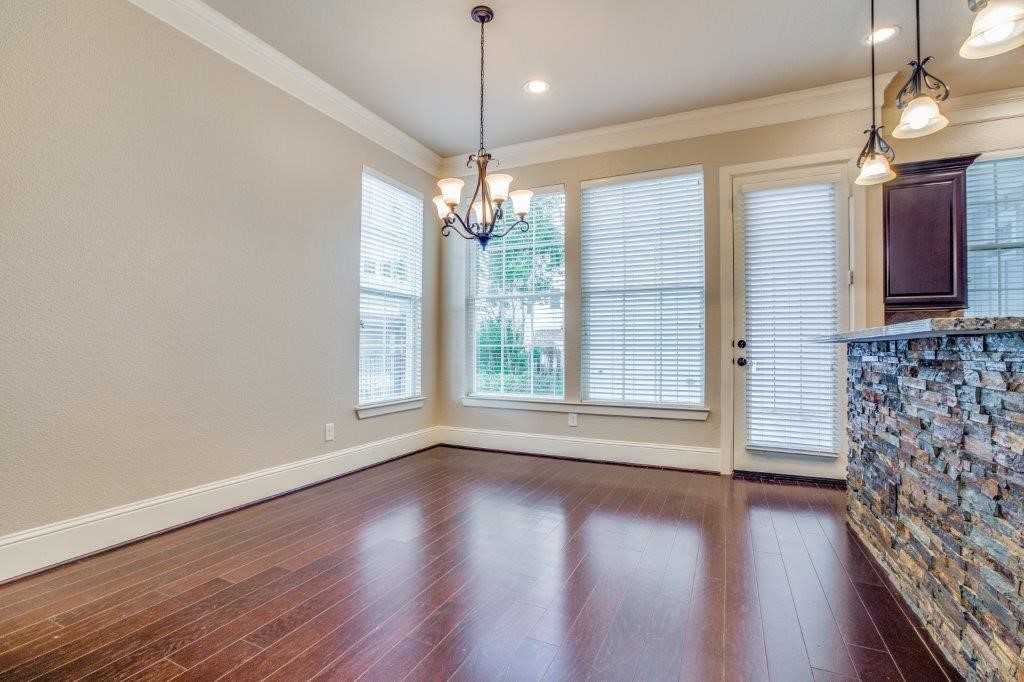 46 East Rafters Row The Woodlands, TX 77380 - Photo 6 of 25 Light-filled dining area overlooking the private courtyard with easy access to outdoor living.