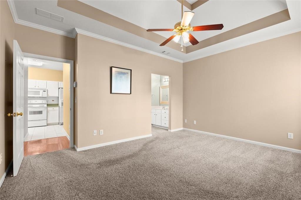1225 Creek Forest Lane Austell, GA 30106 - Photo 13 of 32 a view of an empty room and window with a ceiling fan