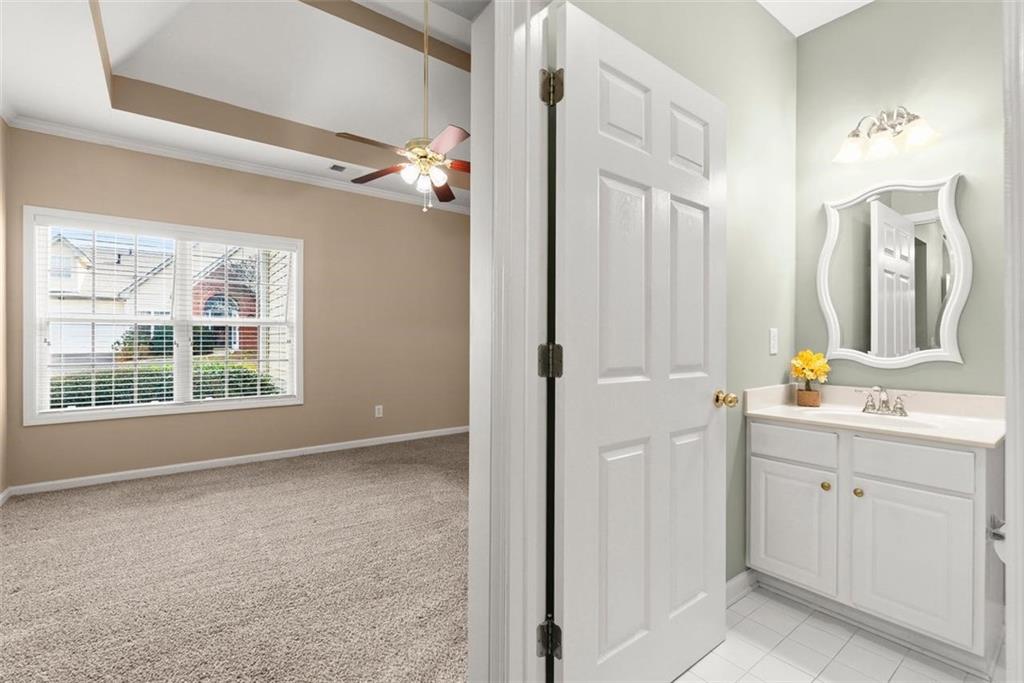 1225 Creek Forest Lane Austell, GA 30106 - Photo 18 of 32 a view of a bathroom with a mirror and a sink
