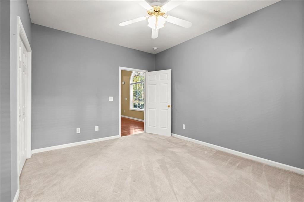 1225 Creek Forest Lane Austell, GA 30106 - Photo 22 of 32 a view of an empty room with a window