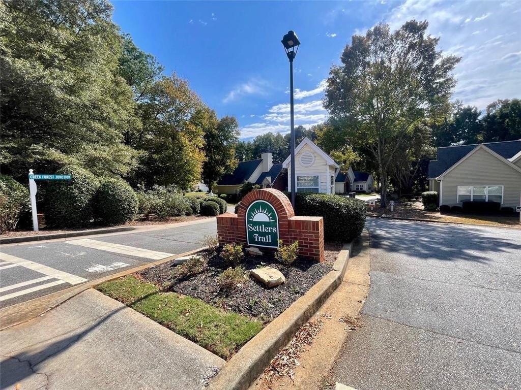 1225 Creek Forest Lane Austell, GA 30106 - Photo 29 of 32 a view of a house with a yard