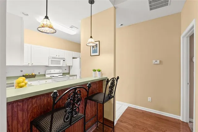 a kitchen with a table and chairs