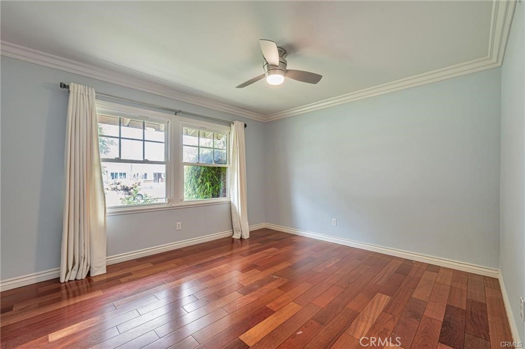 20129 Halsted Street Chatsworth, CA 91311 - Photo 11 of 31 wooden floor in an empty room with a window