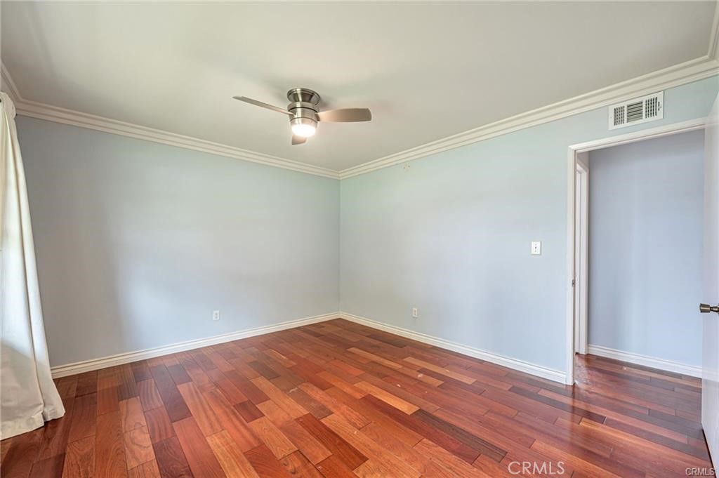 20129 Halsted Street Chatsworth, CA 91311 - Photo 12 of 31 a view of empty room with wooden floor and fan