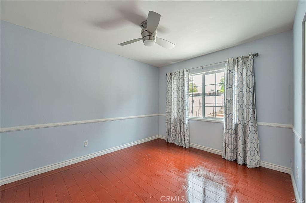 20129 Halsted Street Chatsworth, CA 91311 - Photo 14 of 31 wooden floor in an empty room with a window