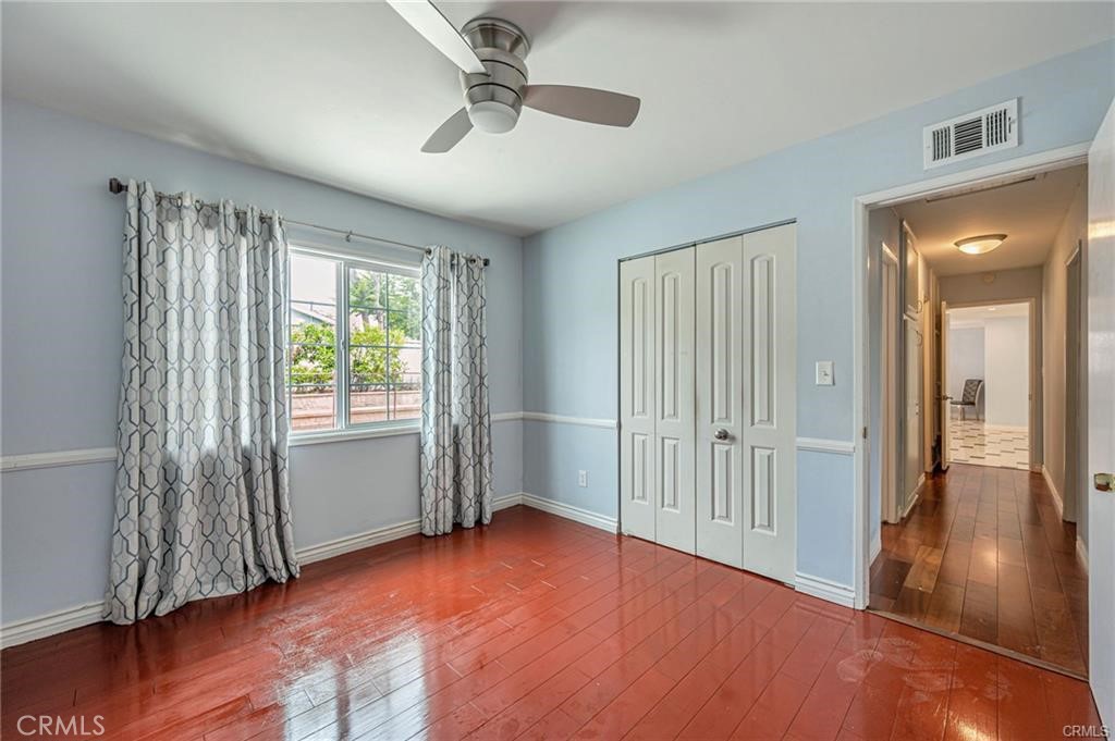 20129 Halsted Street Chatsworth, CA 91311 - Photo 15 of 31 wooden floor in an empty room with a window