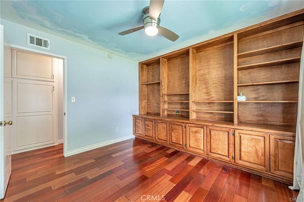 20129 Halsted Street Chatsworth, CA 91311 - Photo 22 of 31 a view of an empty room with wooden floor and a window