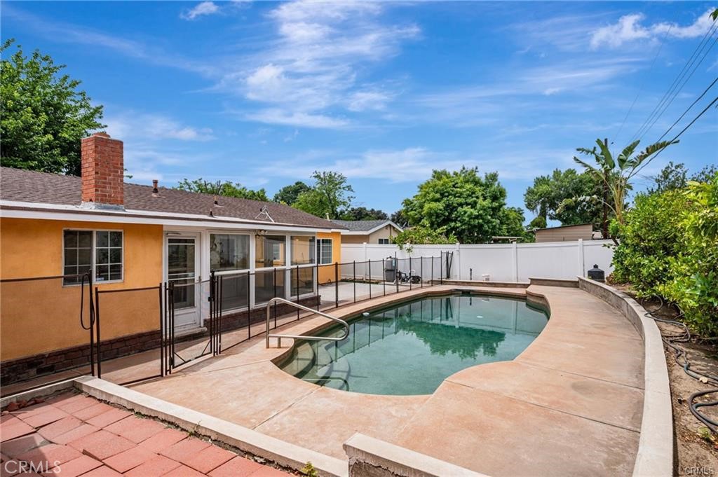 20129 Halsted Street Chatsworth, CA 91311 - Photo 30 of 31 a view of a swimming pool with a patio