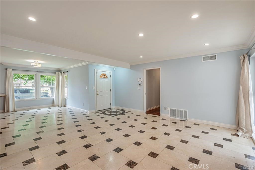 20129 Halsted Street Chatsworth, CA 91311 - Photo 3 of 31 a bedroom with a bed and a dresser