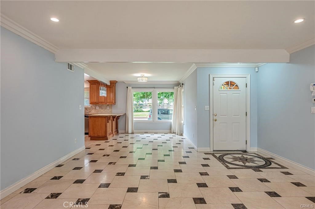 20129 Halsted Street Chatsworth, CA 91311 - Photo 4 of 31 a bedroom with a bed and a window