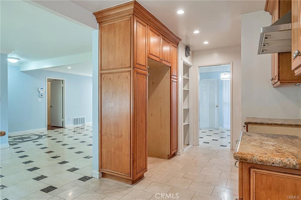 20129 Halsted Street Chatsworth, CA 91311 - Photo 8 of 31 a bathroom with a granite countertop sink and a mirror