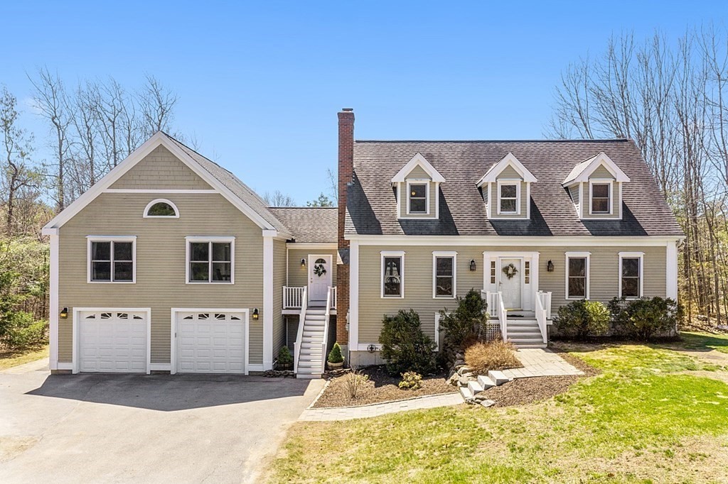 258 West Road Ashby, MA 01431 - Photo 1 of 42 a front view of a house with yard and sitting area