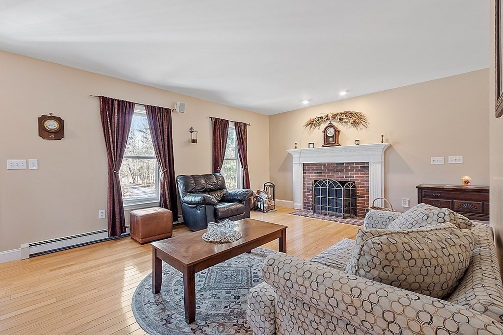 258 West Road Ashby, MA 01431 - Photo 14 of 42 a living room with furniture and a fireplace