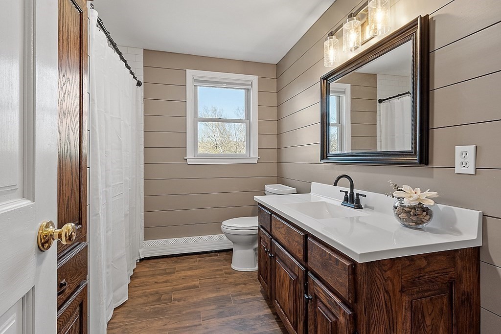 258 West Road Ashby, MA 01431 - Photo 20 of 42 a bathroom with a sink a toilet and shower